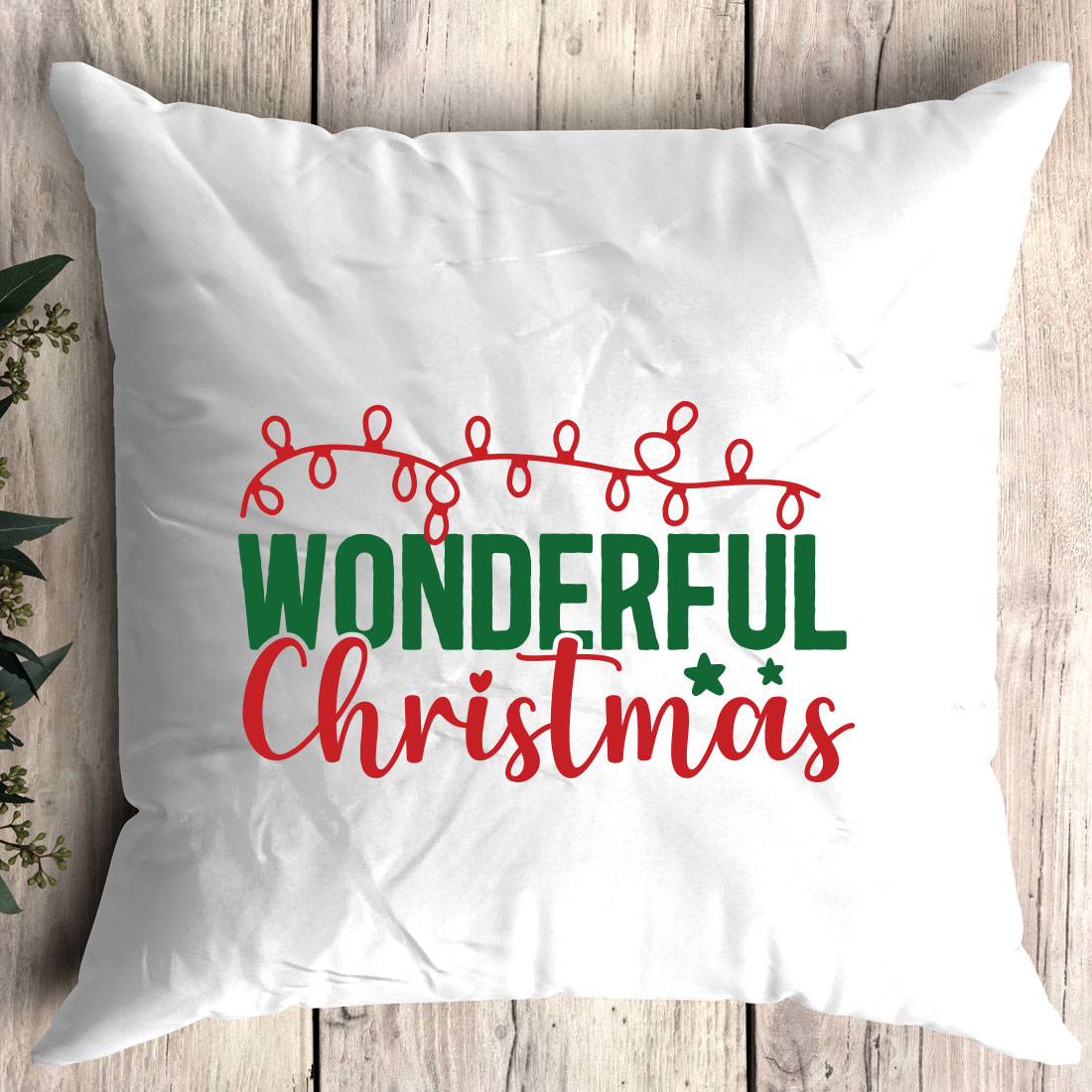 White pillow with the words wonderful christmas on it.