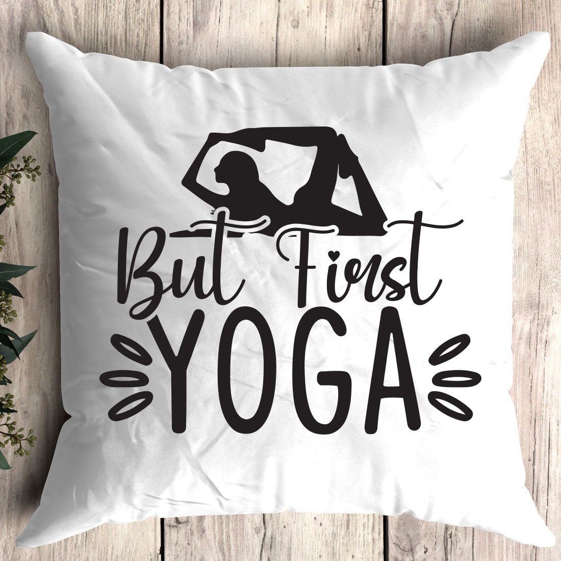 White pillow with the words but first yoga printed on it.