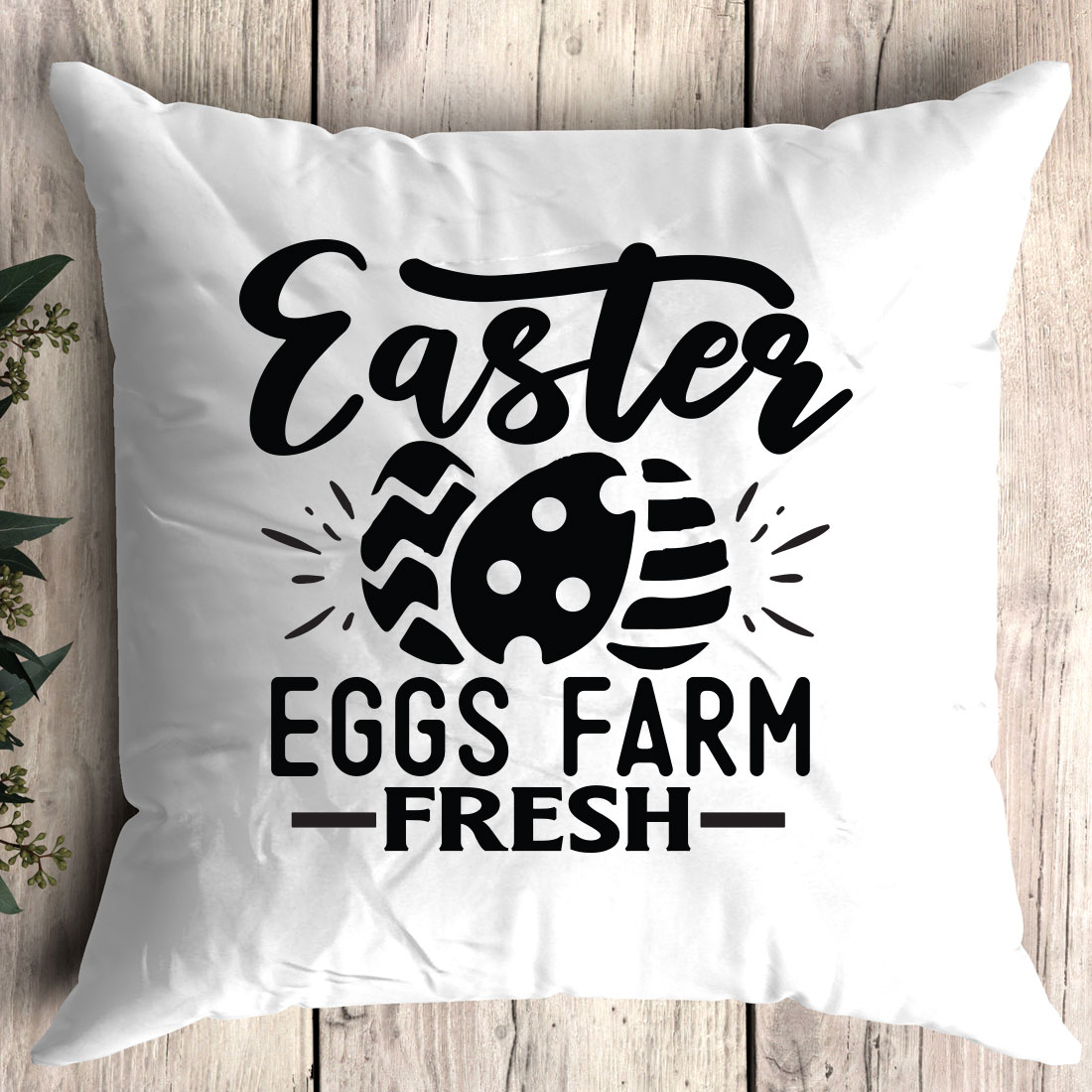 White pillow with the words easter egg farm fresh on it.
