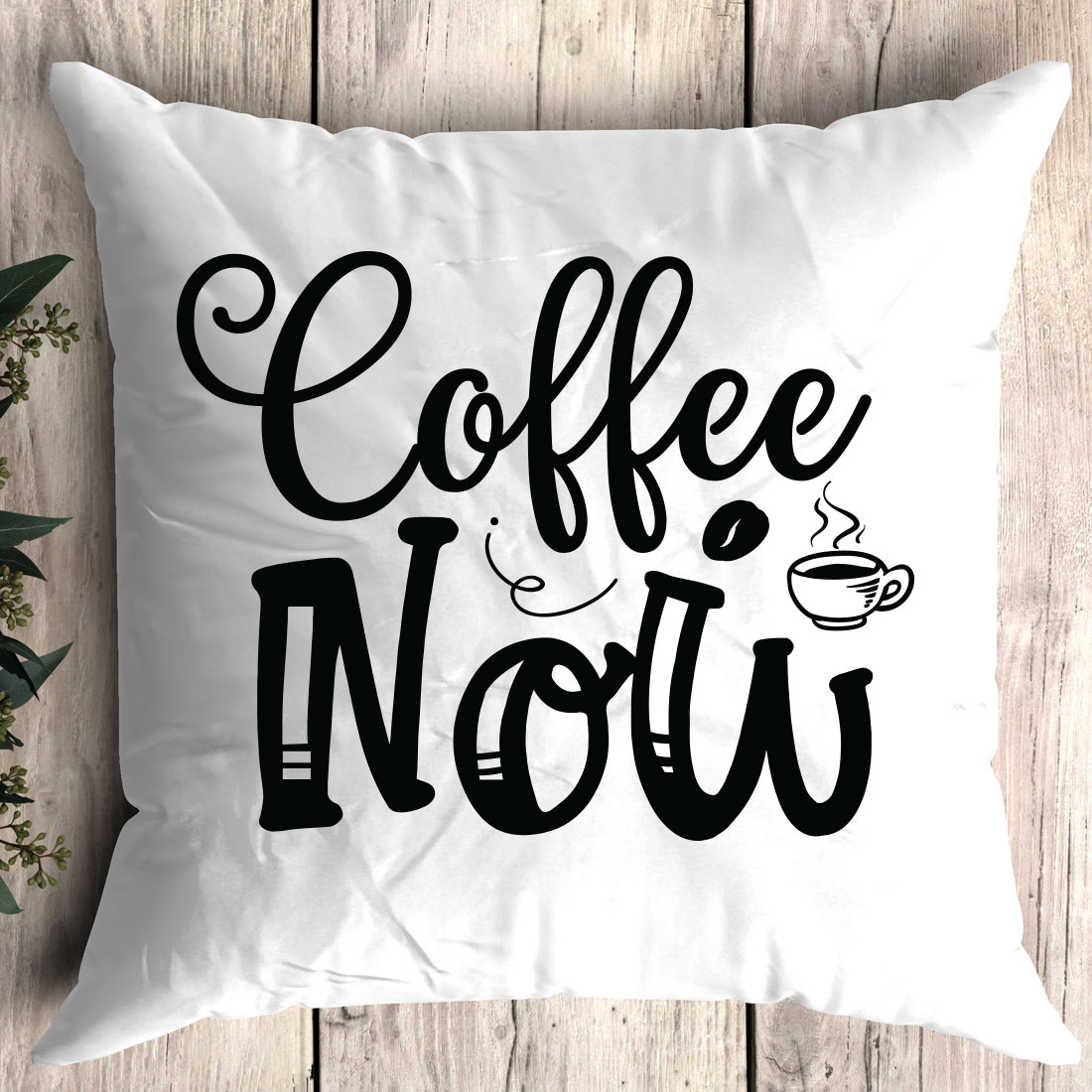 White pillow with the words coffee now printed on it.