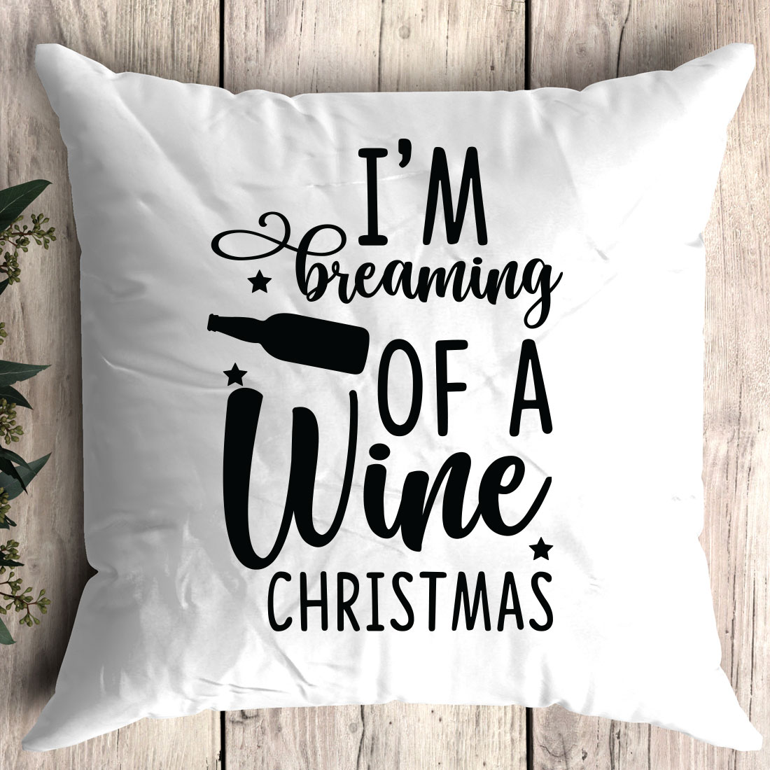 Pillow that says i'm dreaming of a wine christmas.