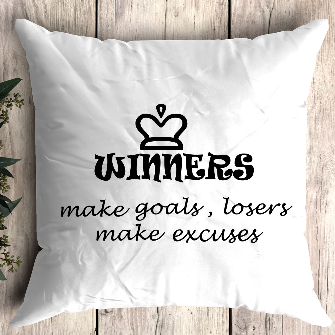 White pillow with the words winners make goals.