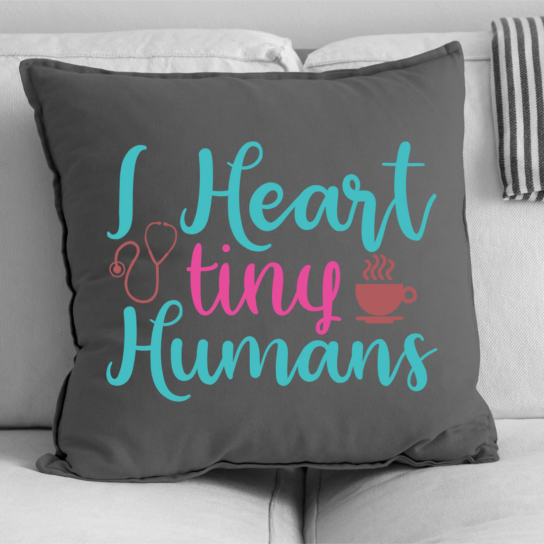 Pillow that says i heart tiny humans.