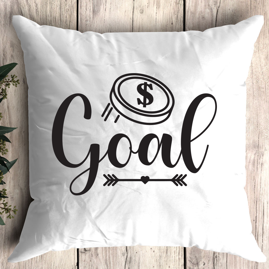 White pillow with the words goal printed on it.