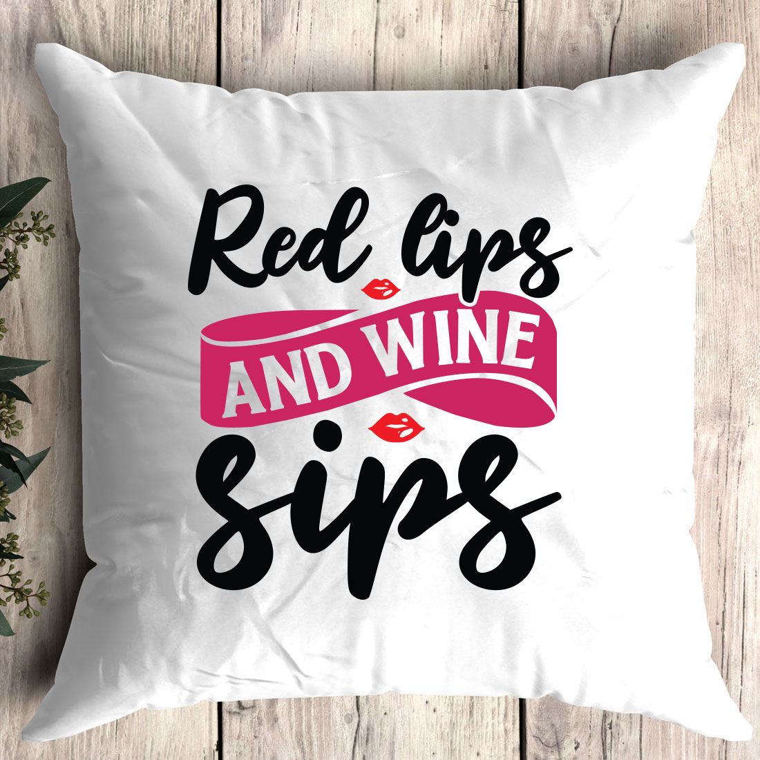 Pillow that says red lips and wine sips.