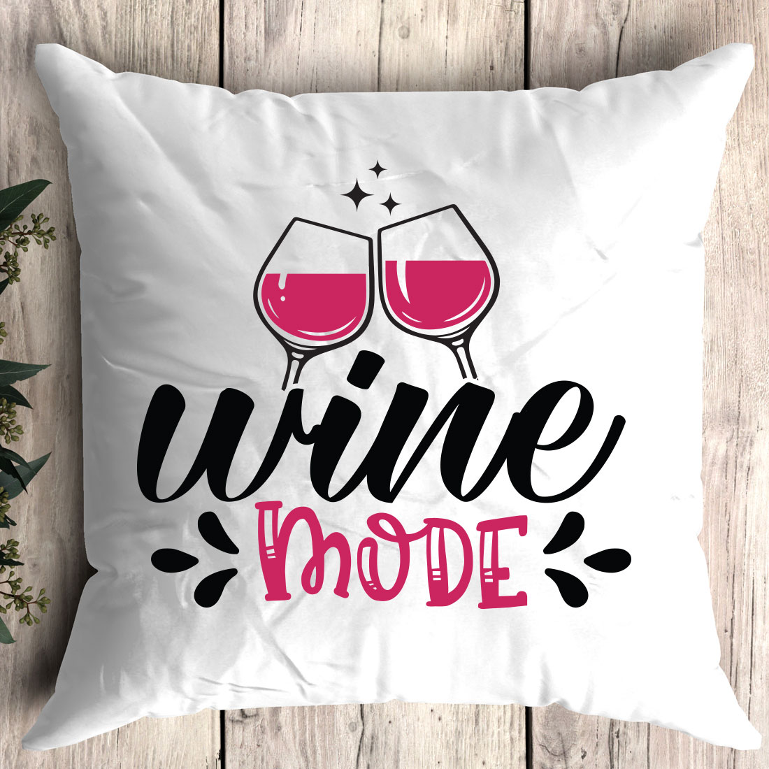 Pillow that says wine mode with two glasses of wine.