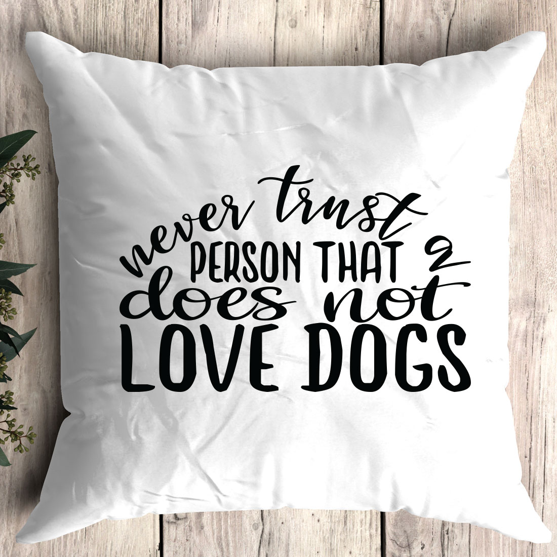 White pillow with the words never trust a person that does not love dogs.