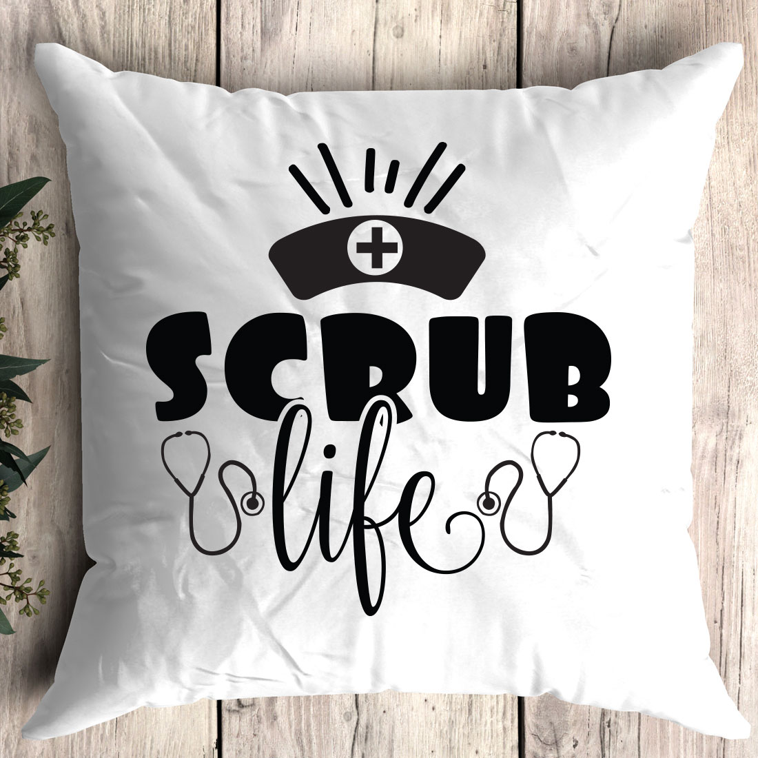 White pillow with the words scrub life on it.