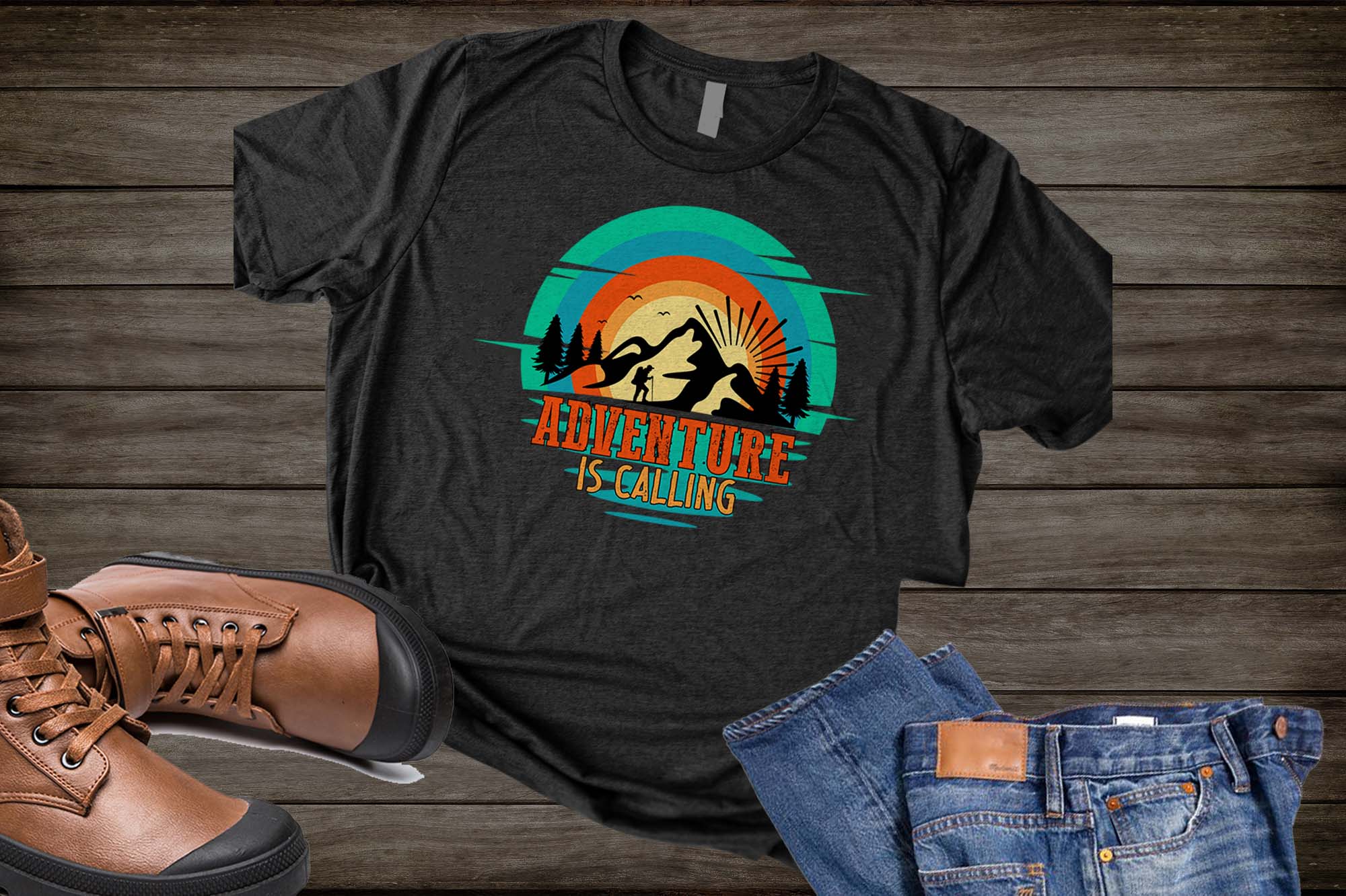 T - shirt with a picture of a man climbing a mountain.