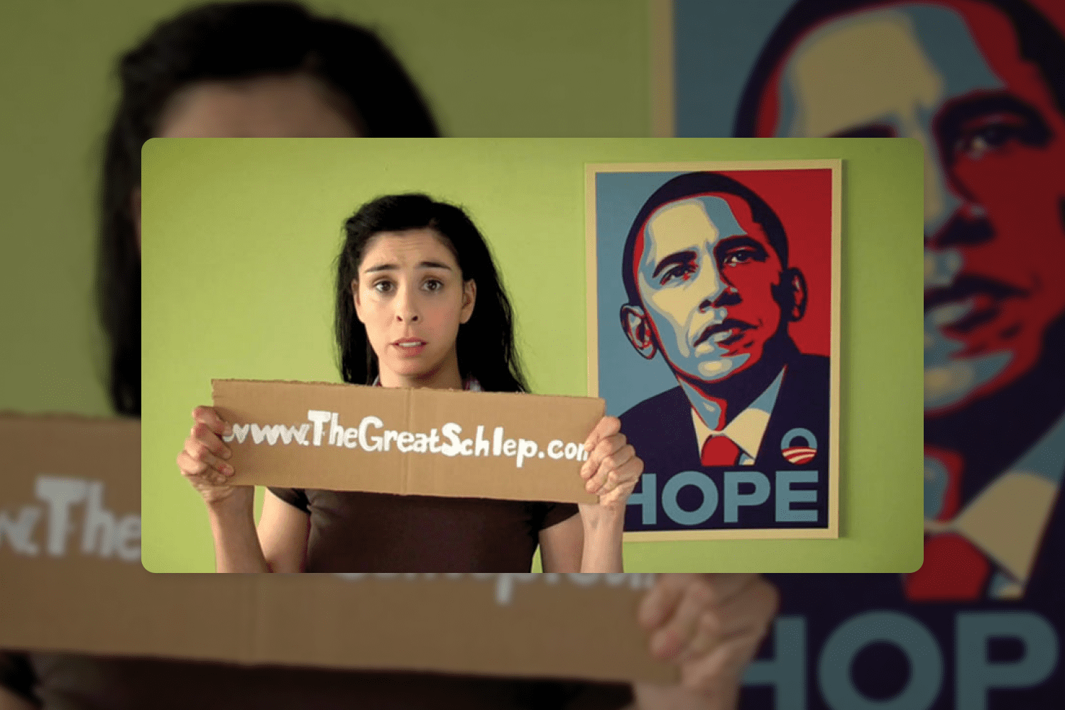 Photo of a girl in front of a portrait of Obama in the style of Andy Warhol.
