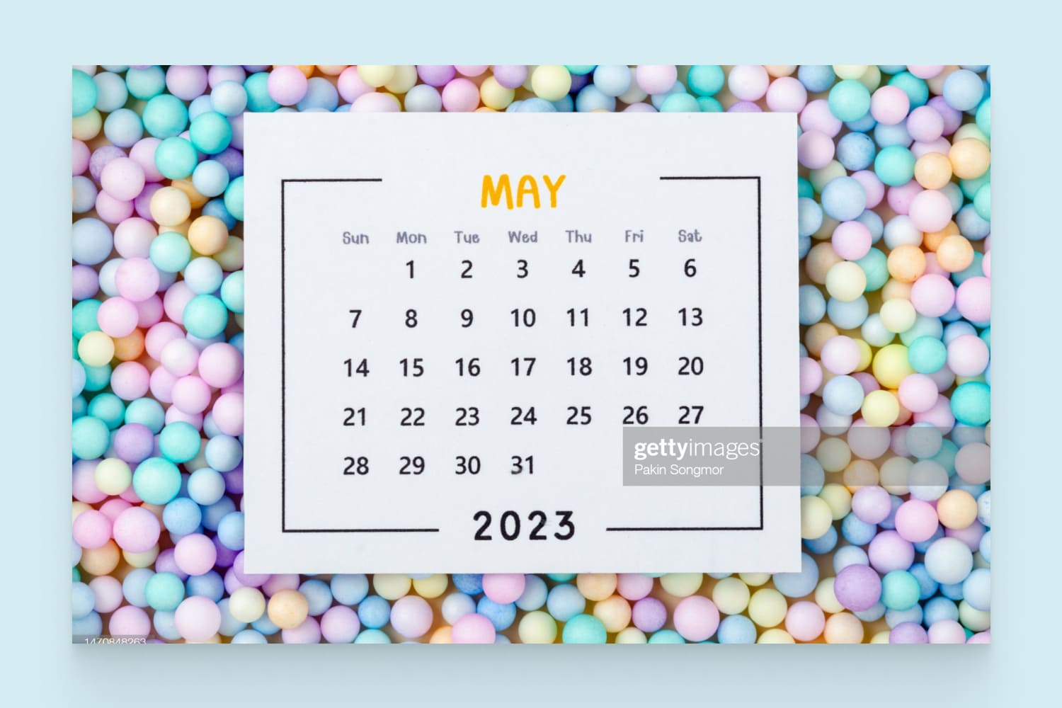 Calendar for May 2023 with a colorful plastic balls background