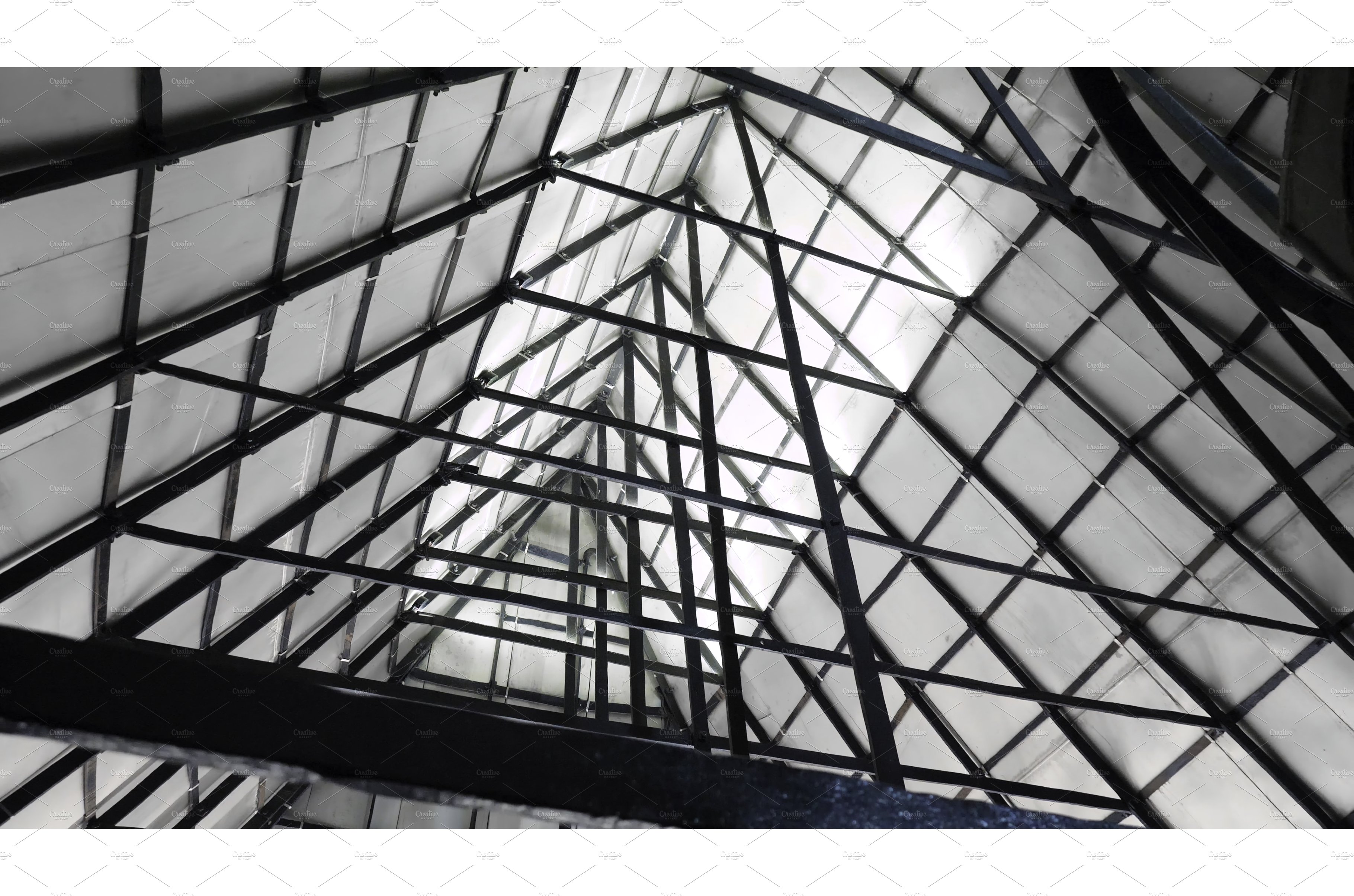 Triangular roof with iron beams cover image.