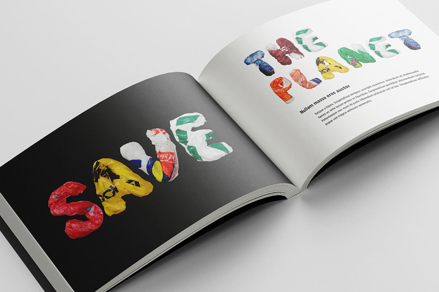 Book spread with large letters from colored bags.