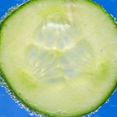 cucumber in water close-up floating cover image.