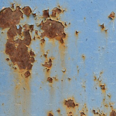 Photo of an old rusty wall with blue cover image.