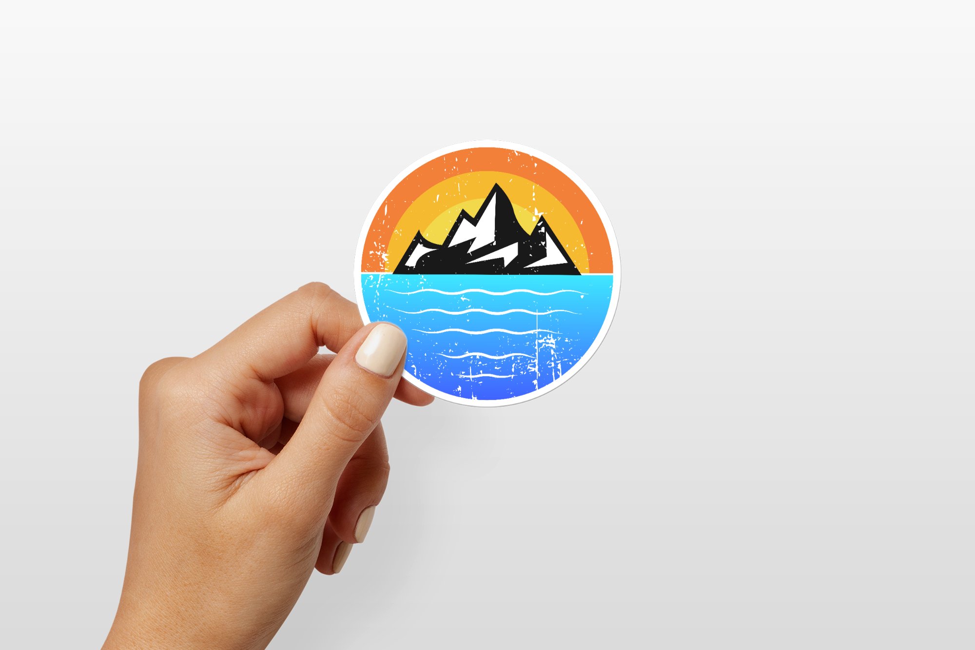 hand holding round sticker mockup 2000x1334 980