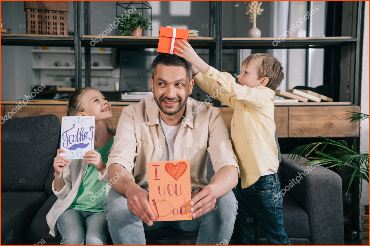 Happy kids with gifts Father's day have fun with father holding greeting card with i love you dad lettering and heart symbol.