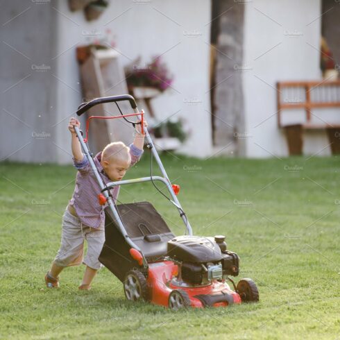 Down syndrome child with lawn mower cover image.