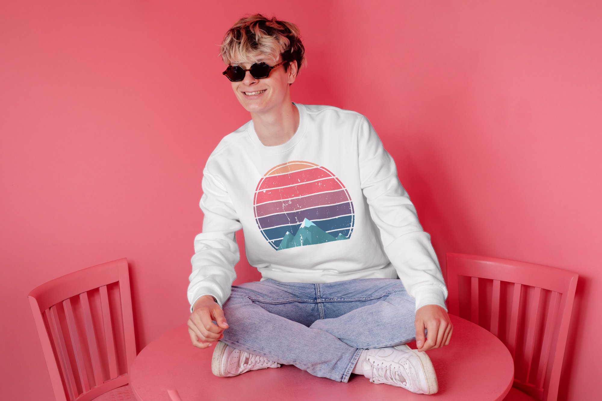 man on table with sunglasses sweatshirt mockup 2000x1334 983