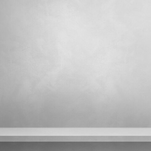 Empty shelf on a white wall. Background template. Vertical backd cover image.