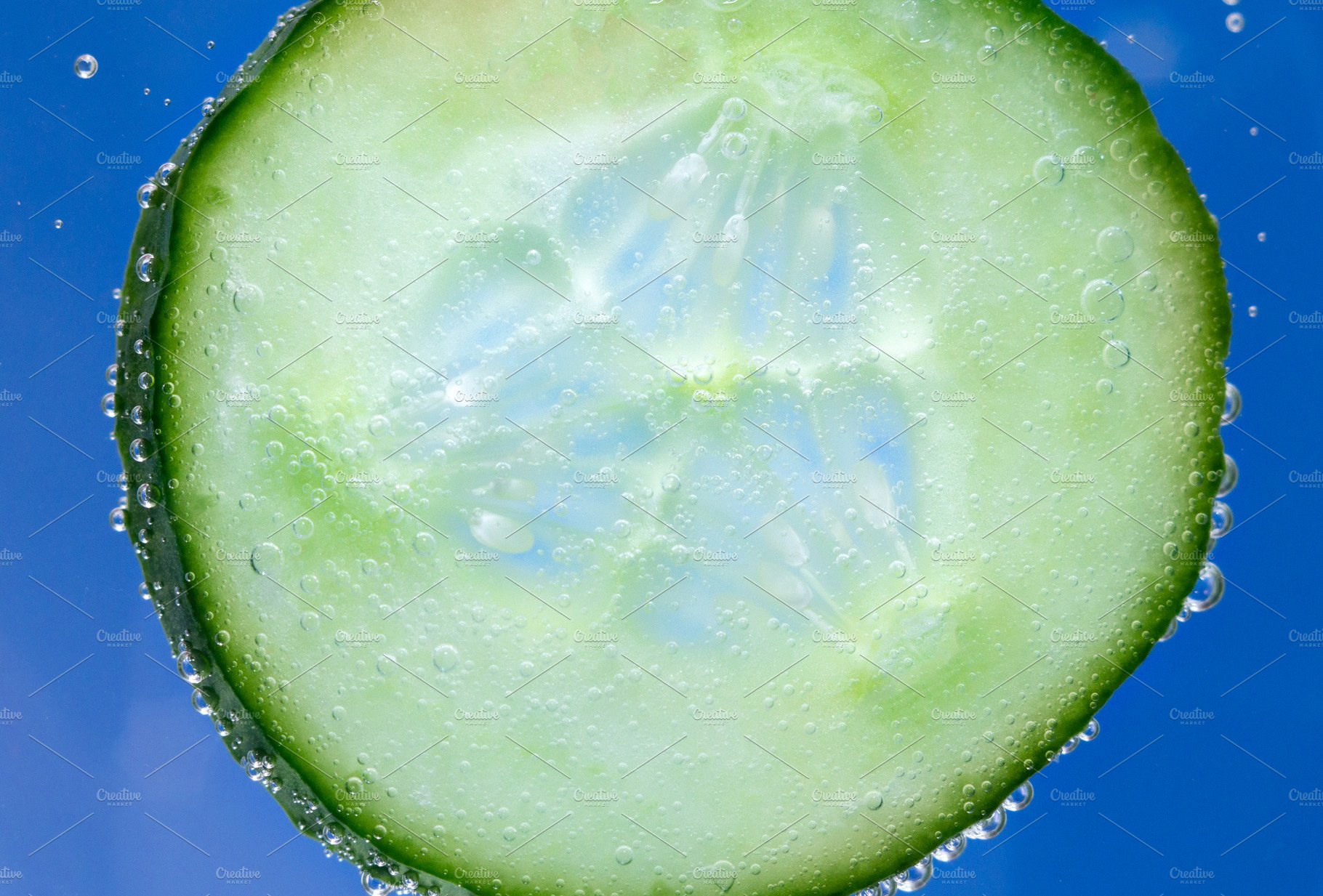 cucumber in water close-up floating cover image.
