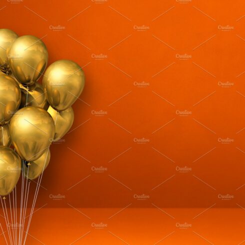 Gold balloons bunch on orange wall background. Horizontal banner cover image.