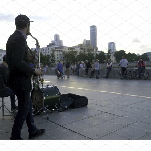 Street musicians play jazz on the cover image.