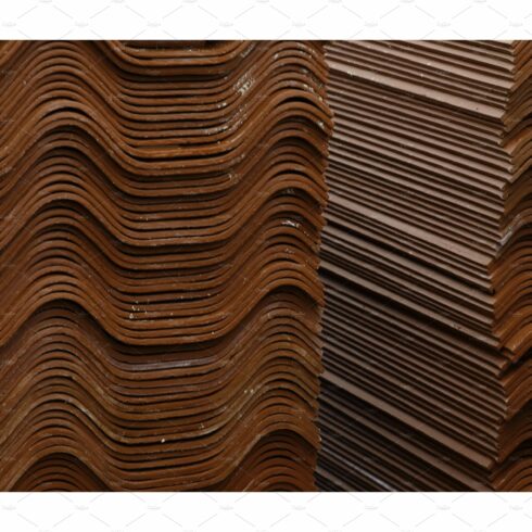 Stack red roof tiles, raw material cover image.