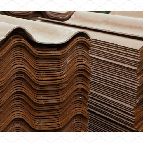 Stack red roof tiles, raw material cover image.