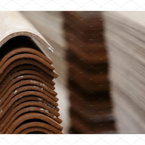Stack red roof tiles, raw material cover image.