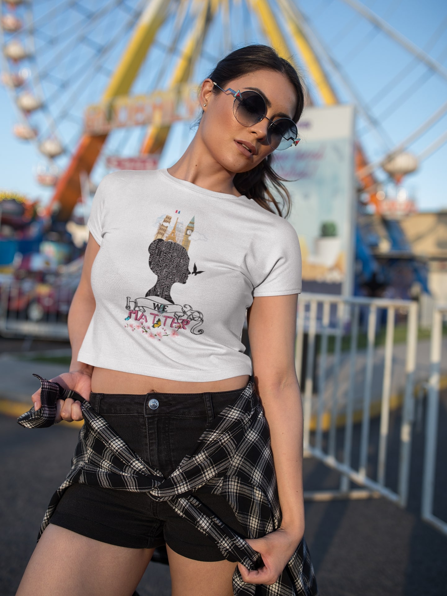 white woman wearing a crop top t shirt mockup at an amusement park a19429 391