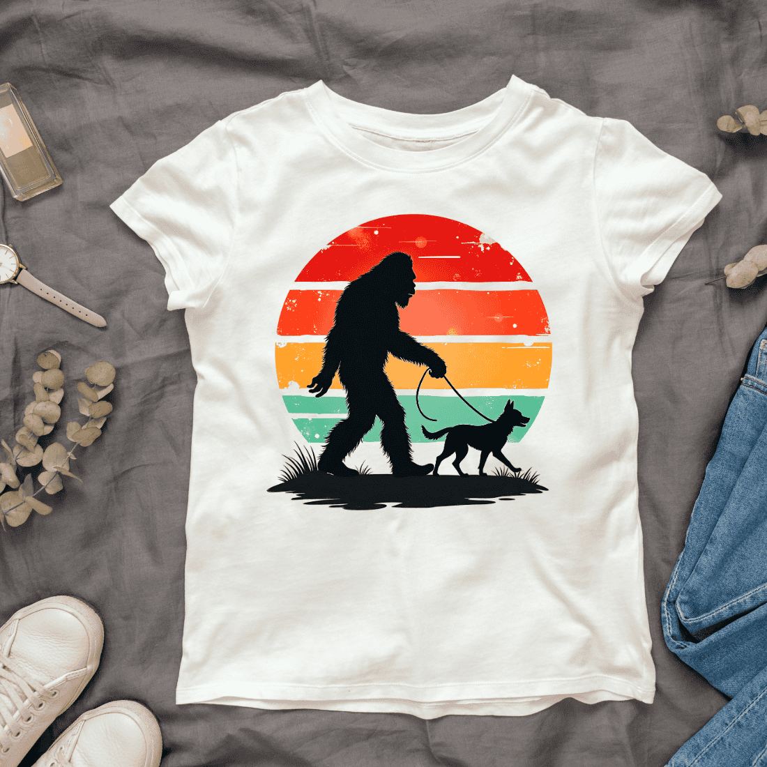 Bigfoot and Dog Walking at Sunset T-shirt Design cover image.