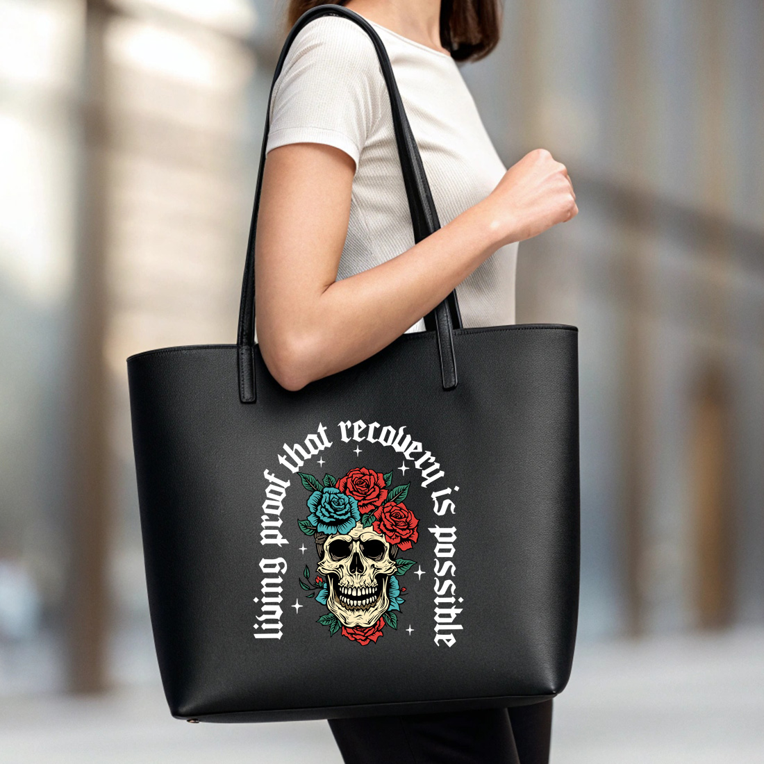 inspirational skull and roses artwork celebrating recovery and resilience black tote beg mock up 13