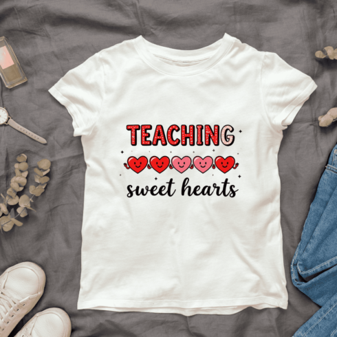 Typography "Teaching sweet hearts" with Smiley faces on hearts T-Shirt Design cover image.