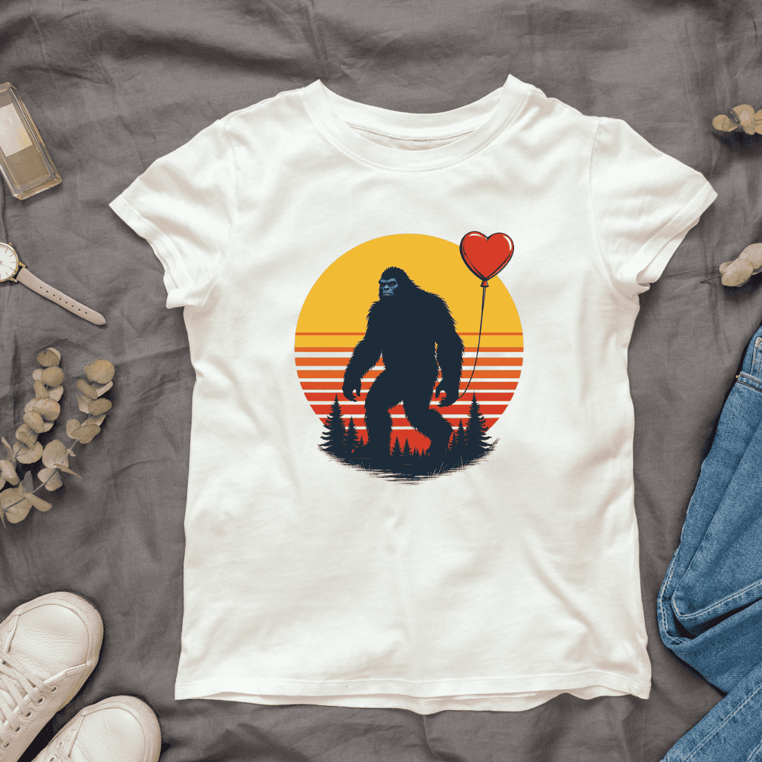 Retro sunset bigfoot with heart-shaped balloon T-shirt Design cover image.