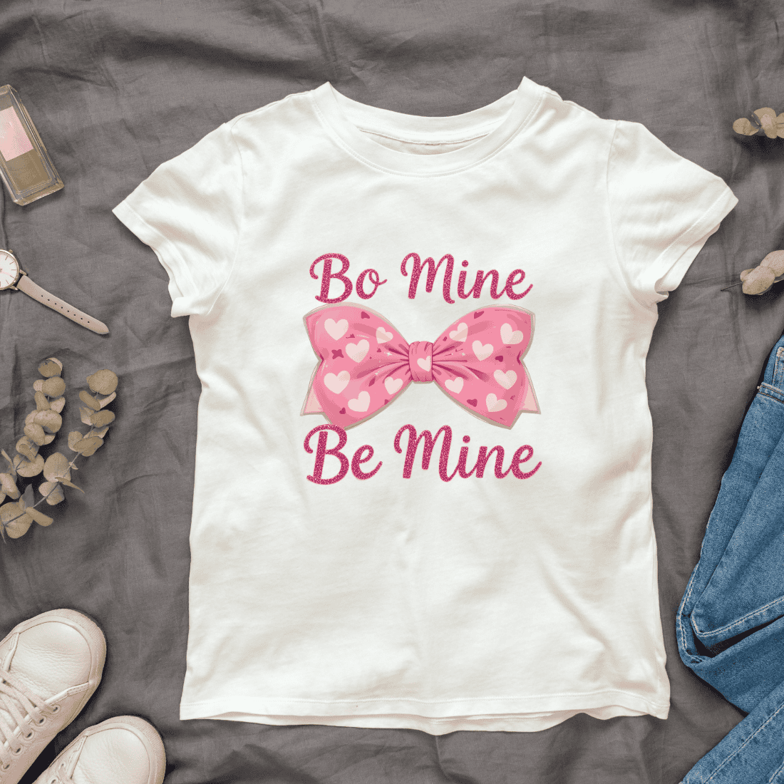 Pink Bow with White Hearts and Be Mine Text T-shirt Design cover image.