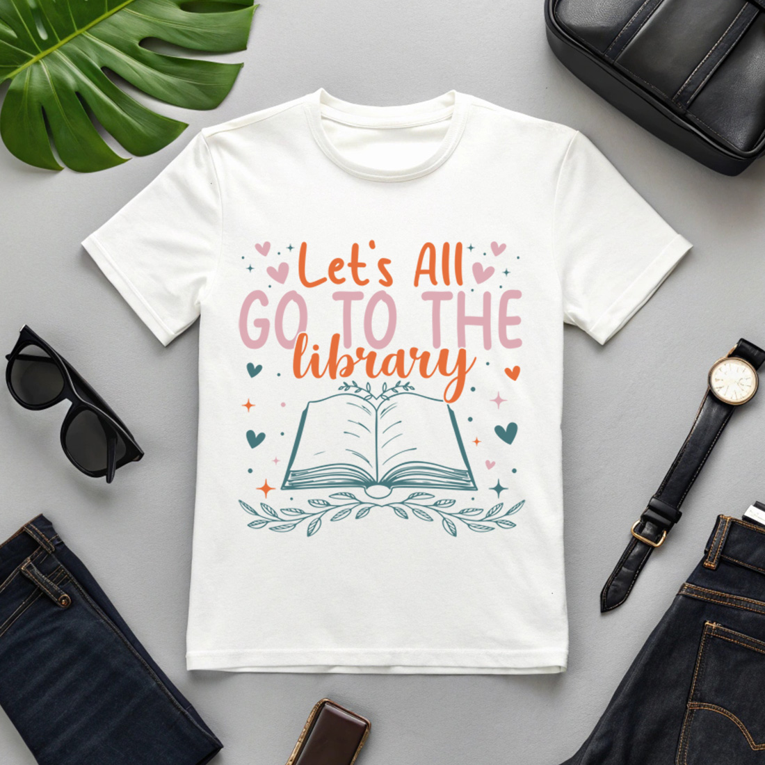 cute book lover t-shirt design with typography 'let's all go to the library' and open book illustration cover image.