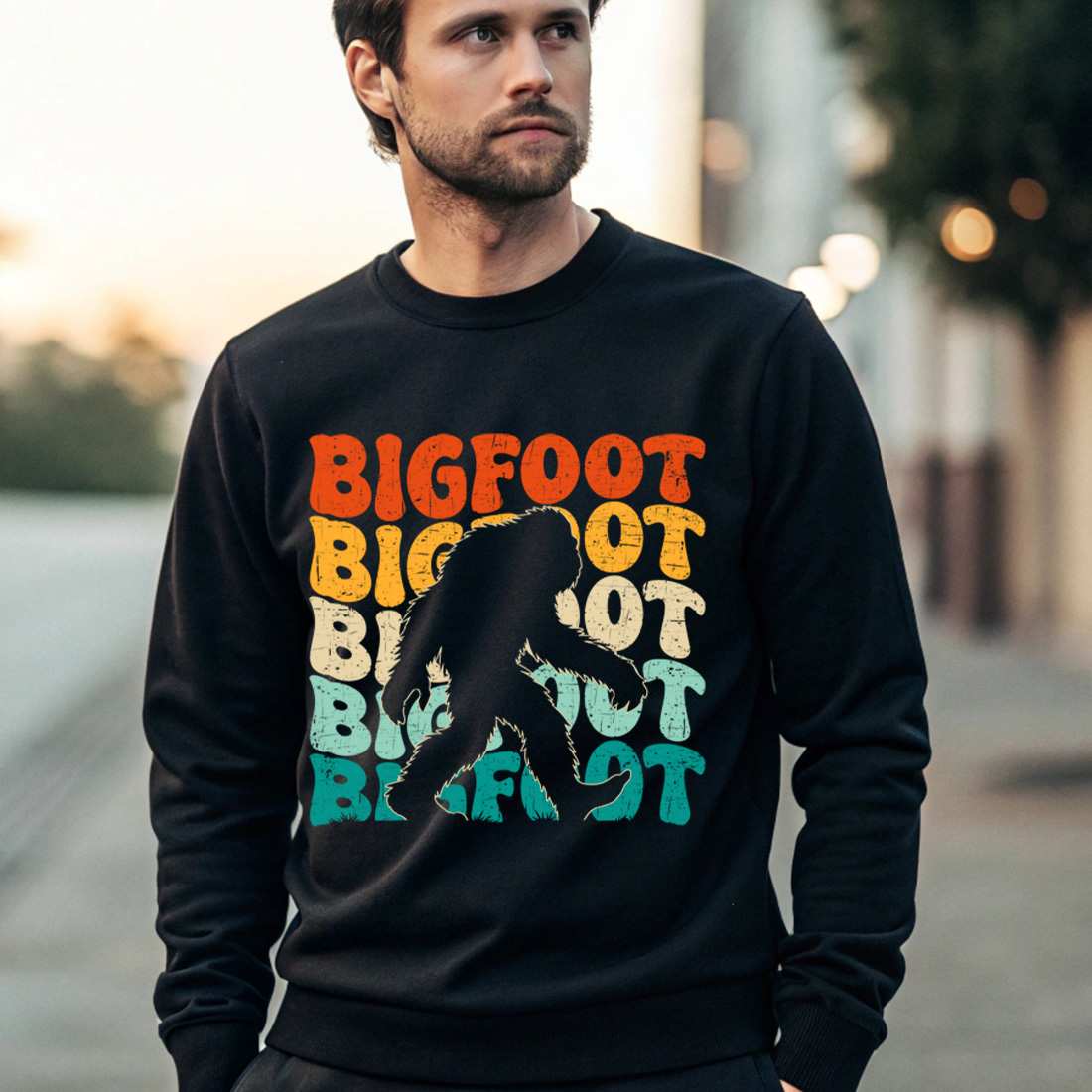 retro bigfoot t shirt design with vintage typography for outdoor and adventure lovers 4 black male sweatshirt mock up 395