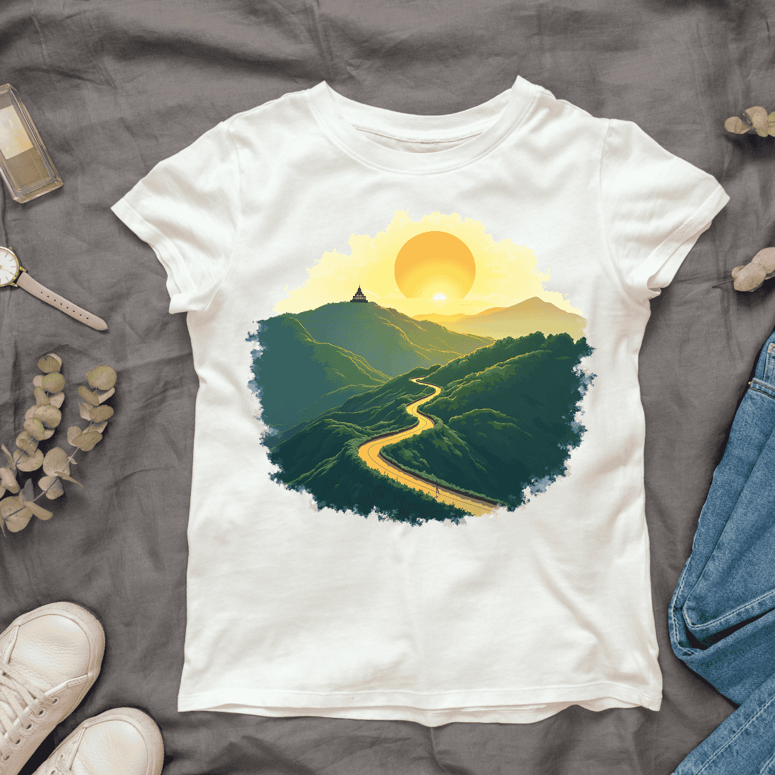 Winding Road Through Green Mountains at Sunset T-shirt Design cover image.