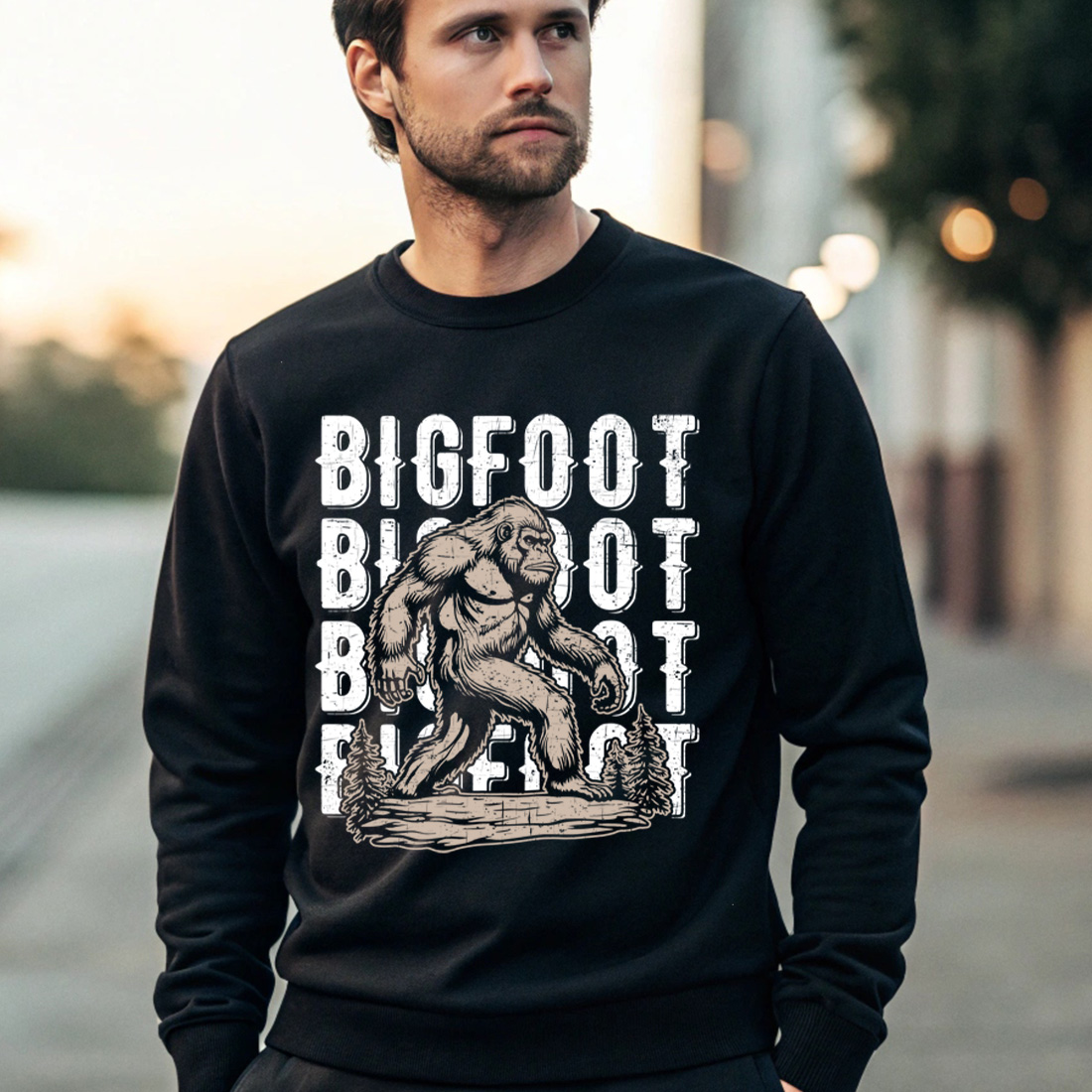 vintage bigfoot t shirt design with distressed text and forest background 4 black male sweatshirt mock up 978