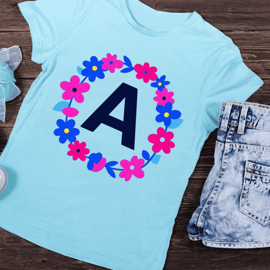 Letter A in Floral Wreath Pink and Blue Flowers T-Shirt Design preview image.