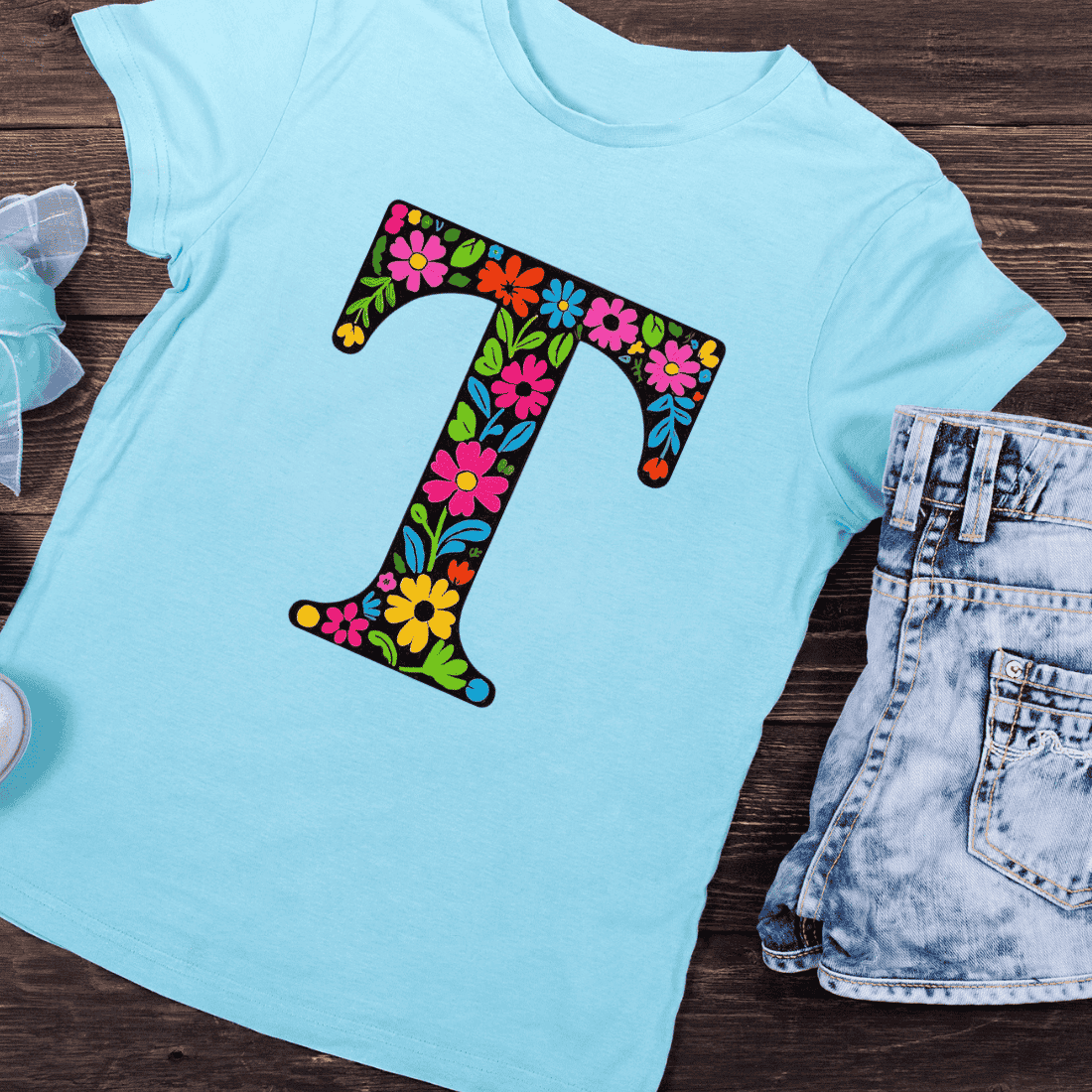 Bold Black T with Vibrant Botanical Accents T-Shirt Design preview image.