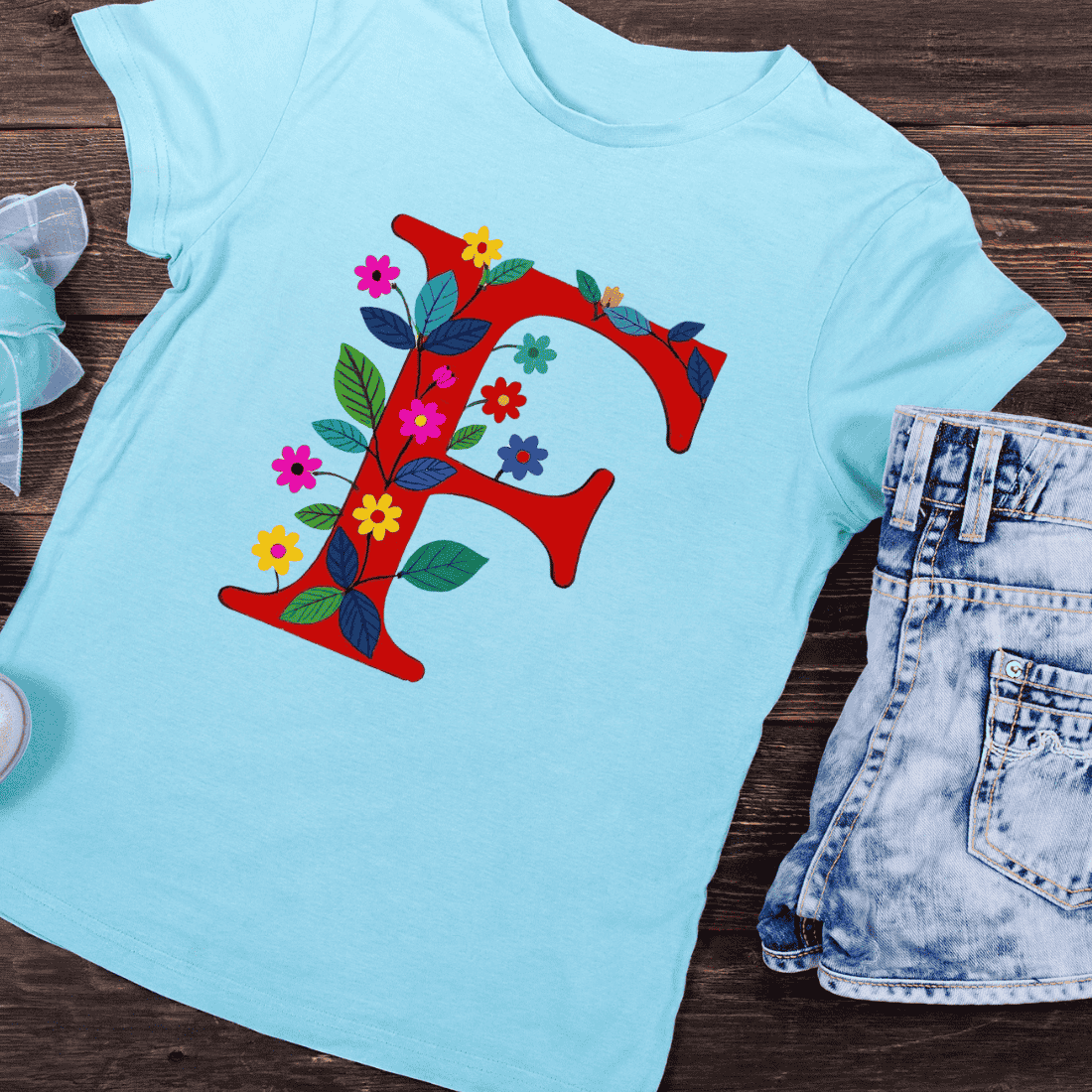 Colorful Letter F with Artistic Botanical Decor T-Shirt Design preview image.
