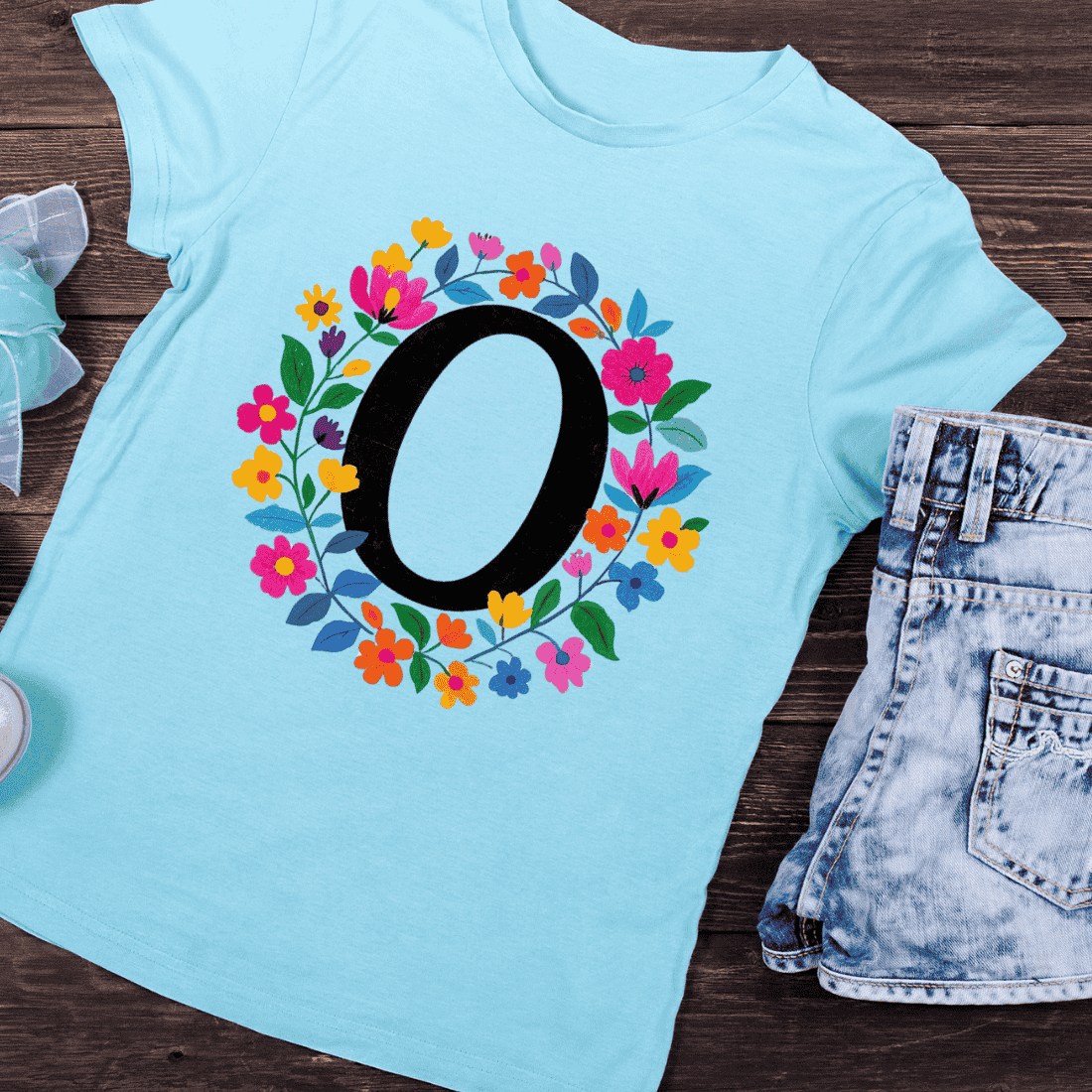 Black Letter O with Colorful Floral Wreath T-Shirt Design preview image.