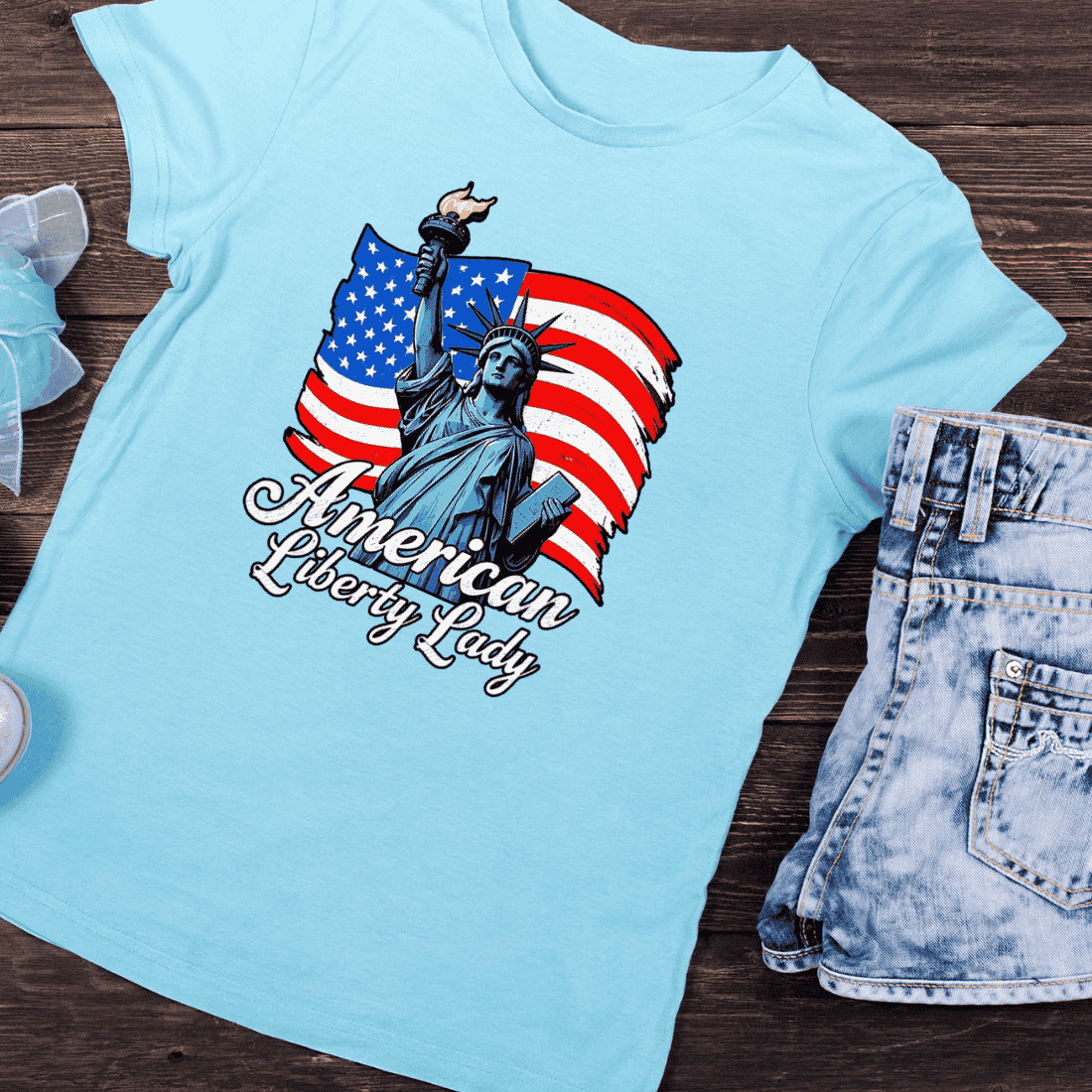 Statue of Liberty with American Flag T-Shirt Design preview image.