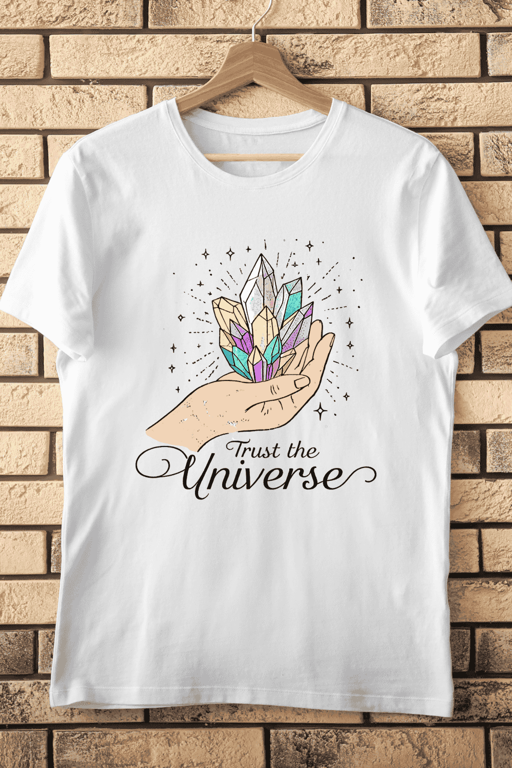 Hand Holding Colorful Crystals Trust the Universe T-Shirt Design pinterest preview image.