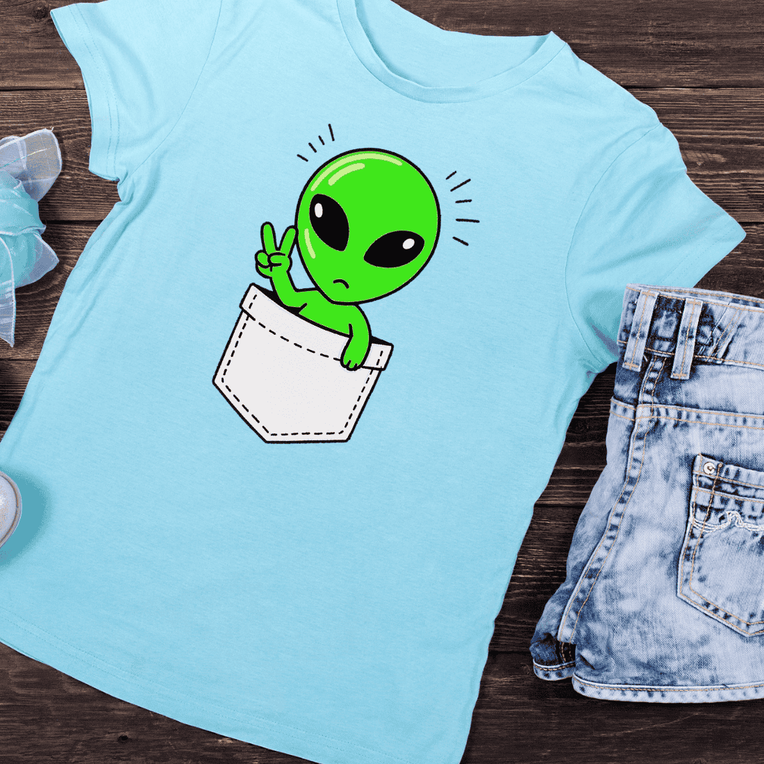 Cute Alien in Pocket PNG T-Shirt Design preview image.