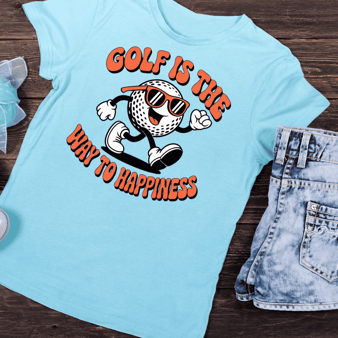 Cheerful Golf Ball Mascot T-Shirt Design preview image.
