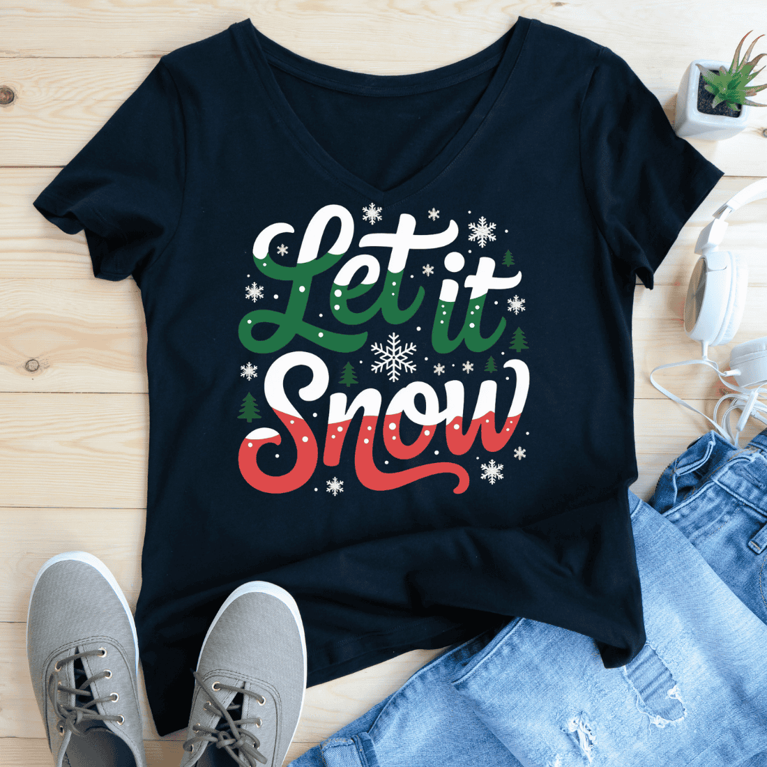 Festive Let It Snow Winter Holiday Typography T-Shirt Design preview image.