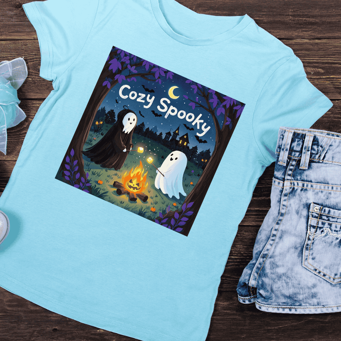 Cozy Spooky Ghost Campfire T-Shirt Design preview image.